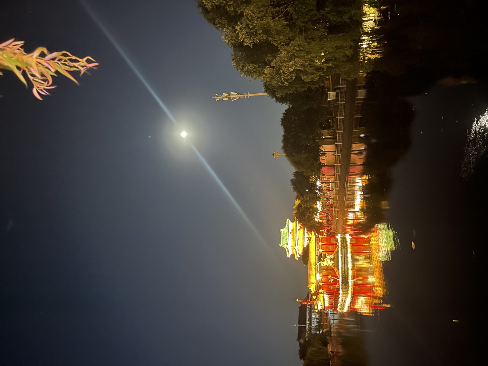 Illuminated dragon boat on a Beijing canal at night